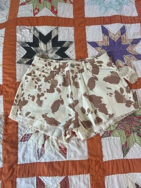 Altar'd State Cream and Brown Cow Print Denim Shorts